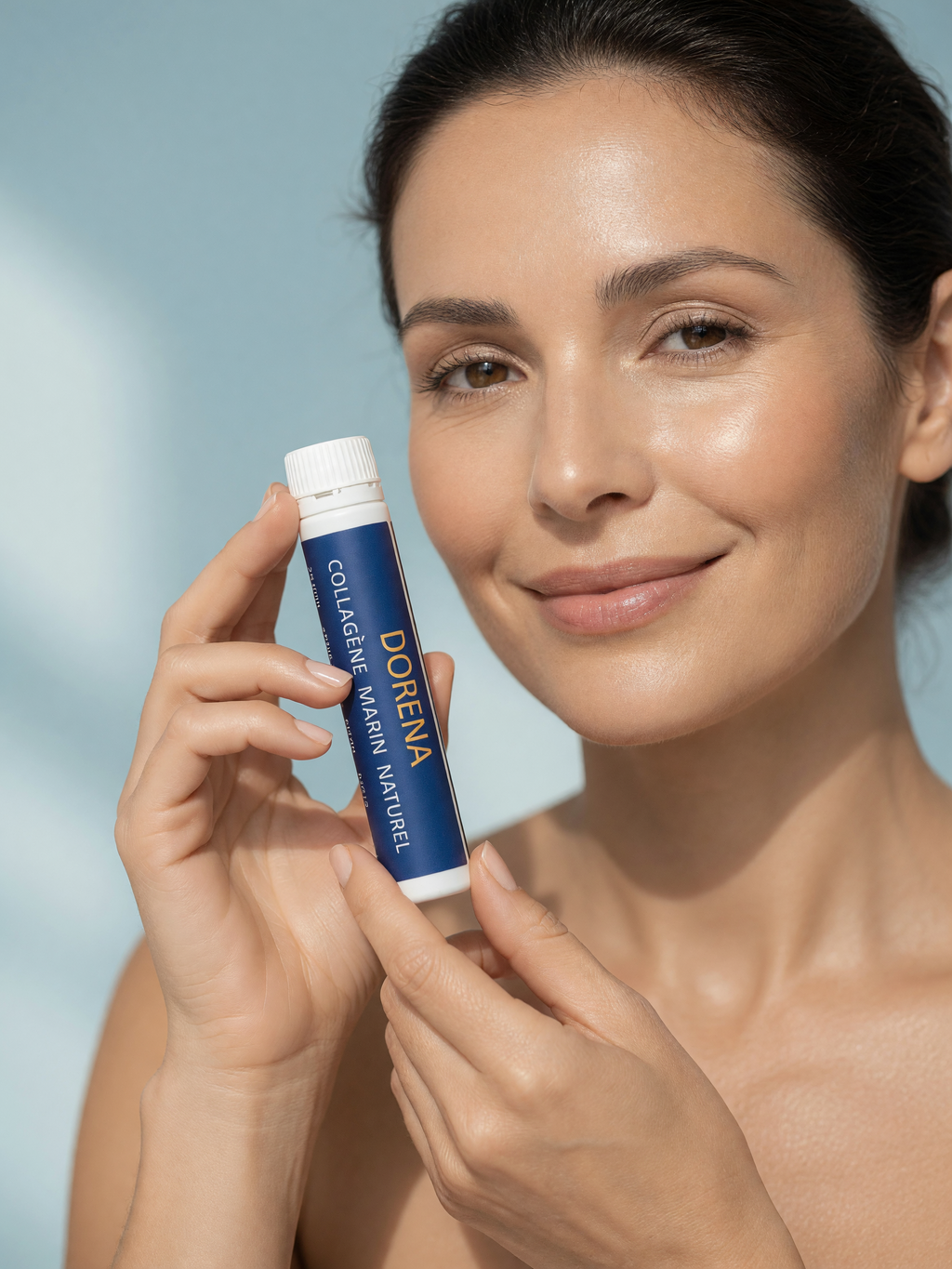 Woman holding a DORENA collagen shot